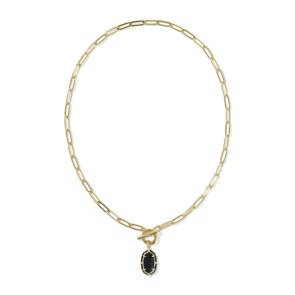 A gold paperclip chain necklace with a toggle clasp and a small oval black onyx pendant, shown on a plain white background.