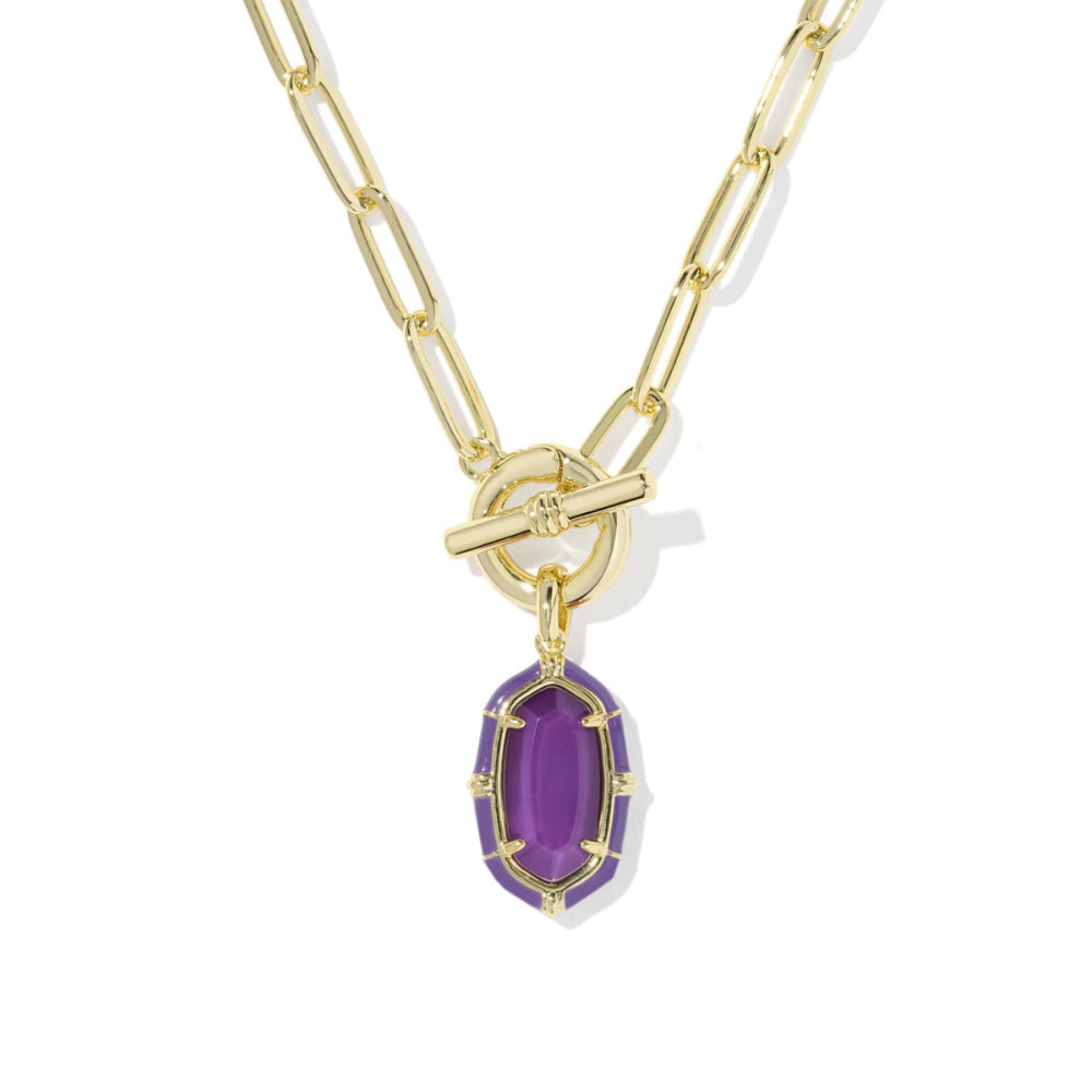 A gold paperclip chain necklace with a toggle clasp and a purple oval gemstone pendant, shown on a clean white background.