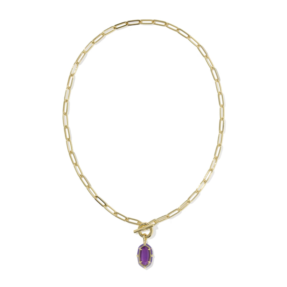 A gold paperclip chain necklace with a toggle clasp and a small oval purple gemstone pendant, shown on a plain white background.