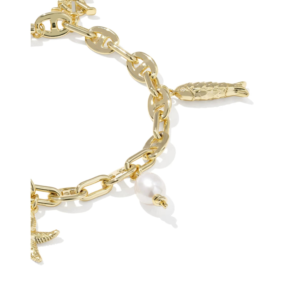 Gold chain bracelet with charms on a white background