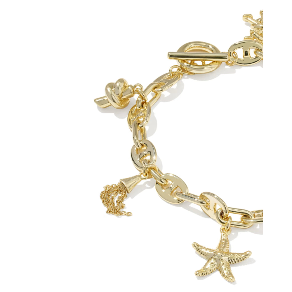 Gold bracelet with starfish charm on a white background