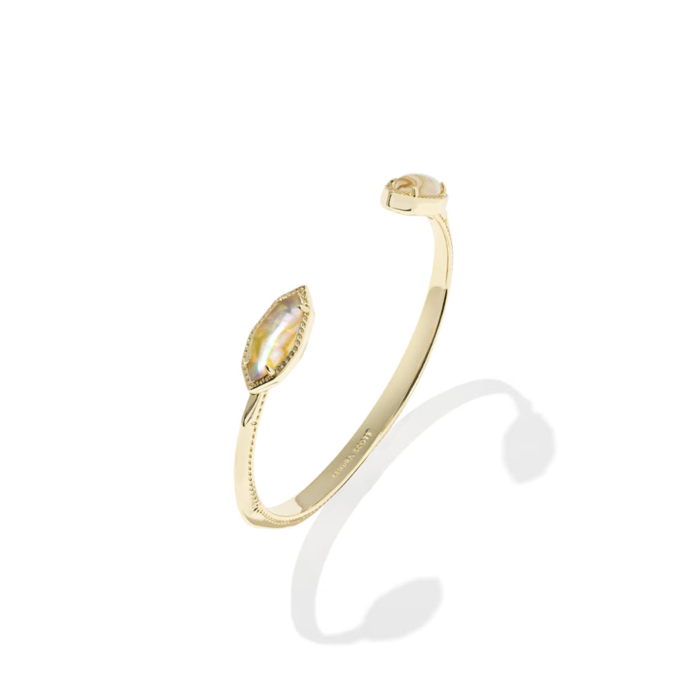 Gold open bangle with marquise-shaped gemstones on a white background