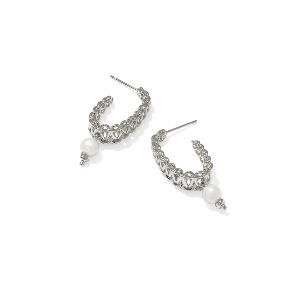 Silver hoop earrings with pearls on a white background