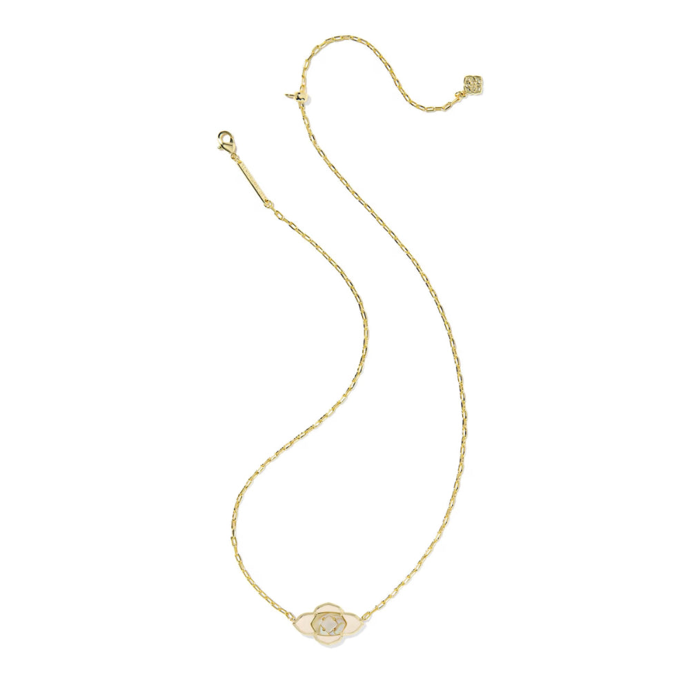 Gold necklace with a small round pendant on a white background