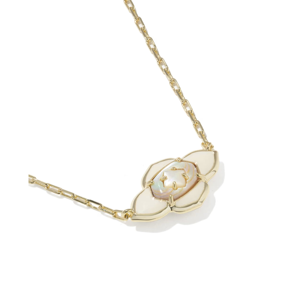 Gold necklace with a white pendant on a white background