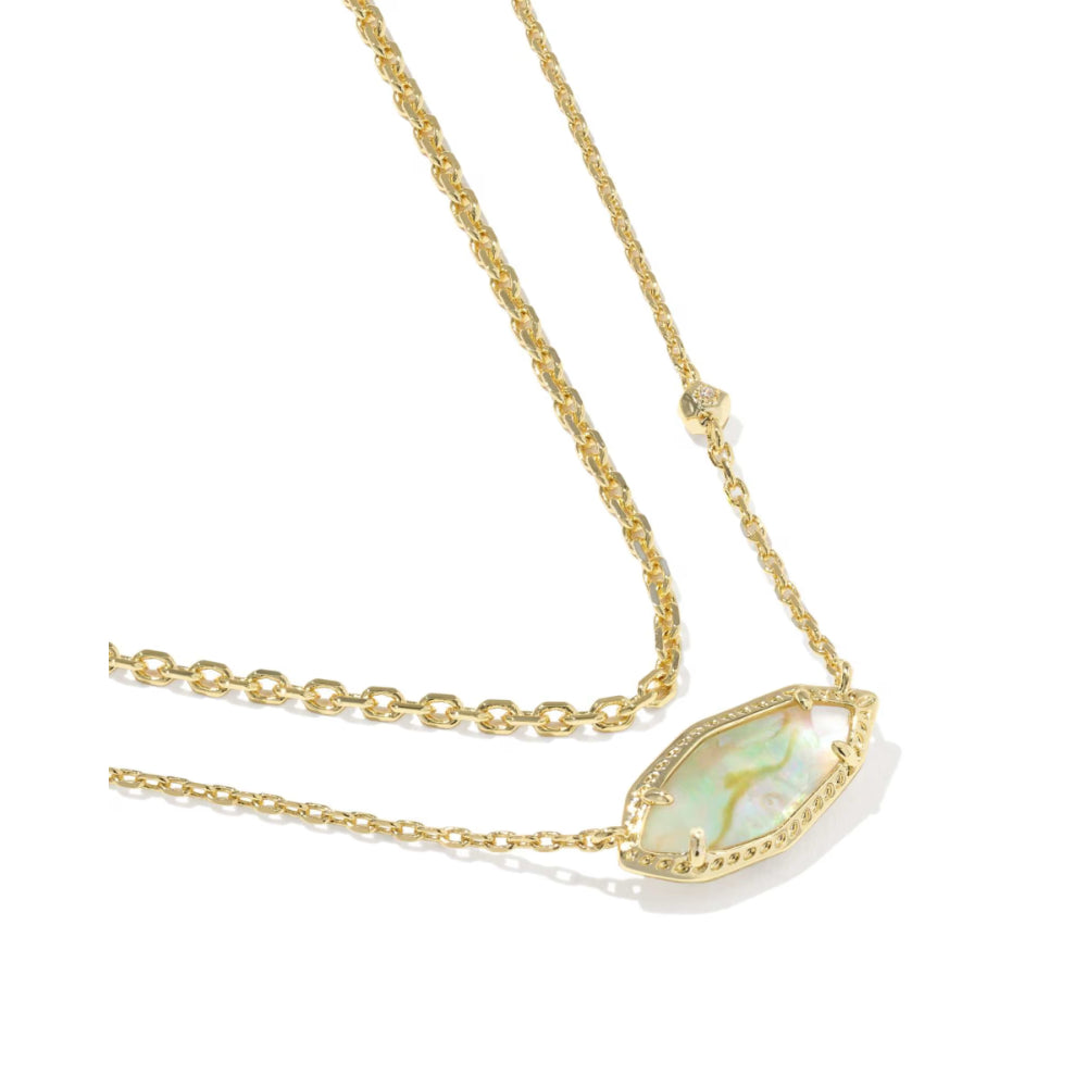 Gold necklace with a teardrop-shaped opal pendant on a white background