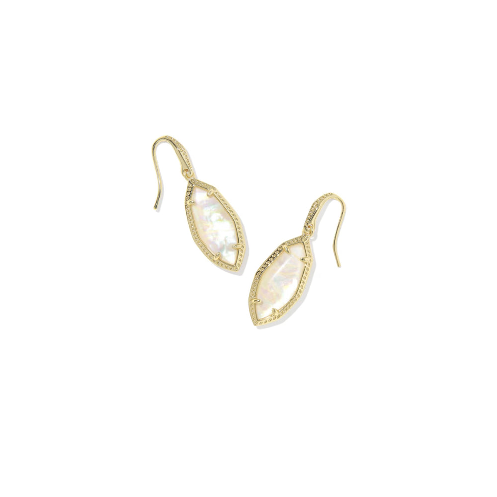 Gold earrings with clear gemstones on a white background