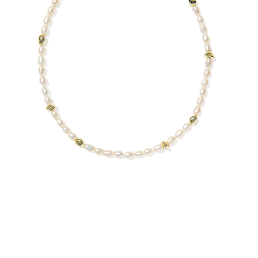 Necklace with pearls and gold beads on a white background