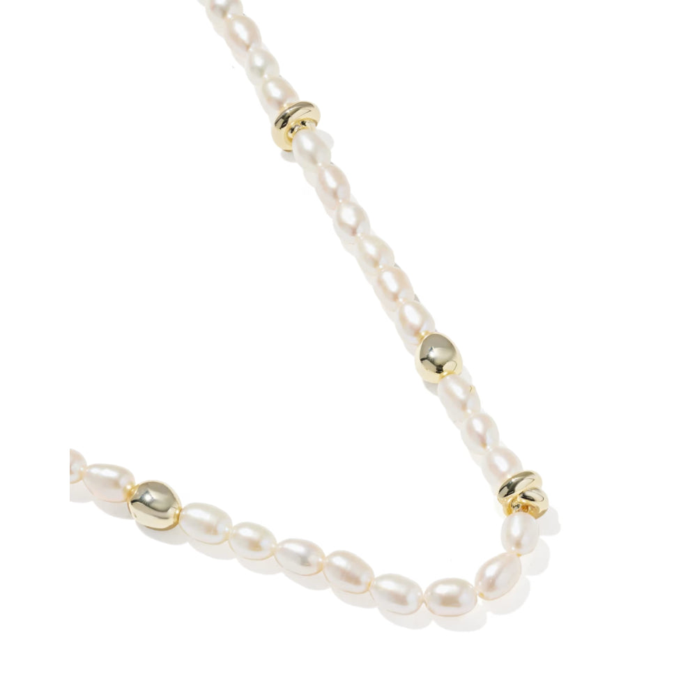 Pearl necklace with gold beads on a white background