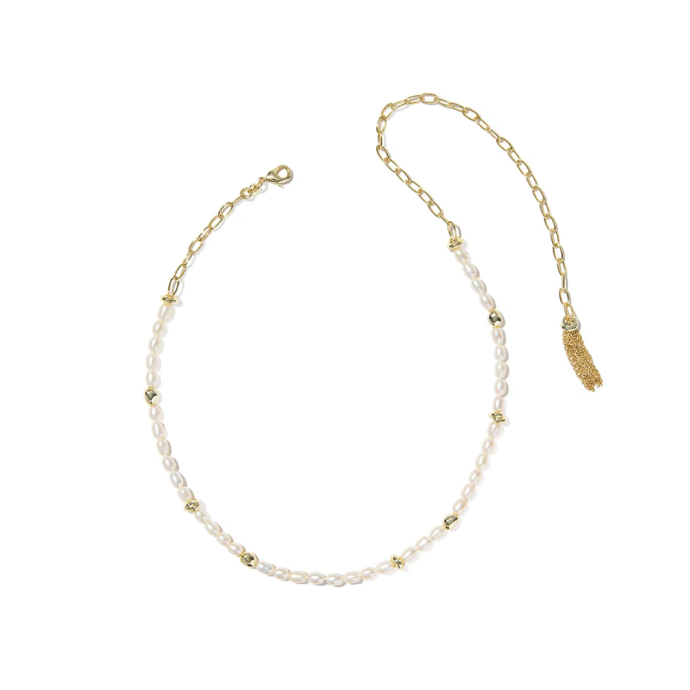 Gold and pearl necklace on a white background