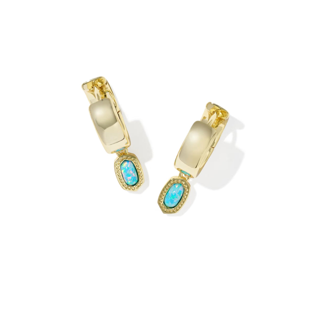 Gold earrings with turquoise stones on a white background