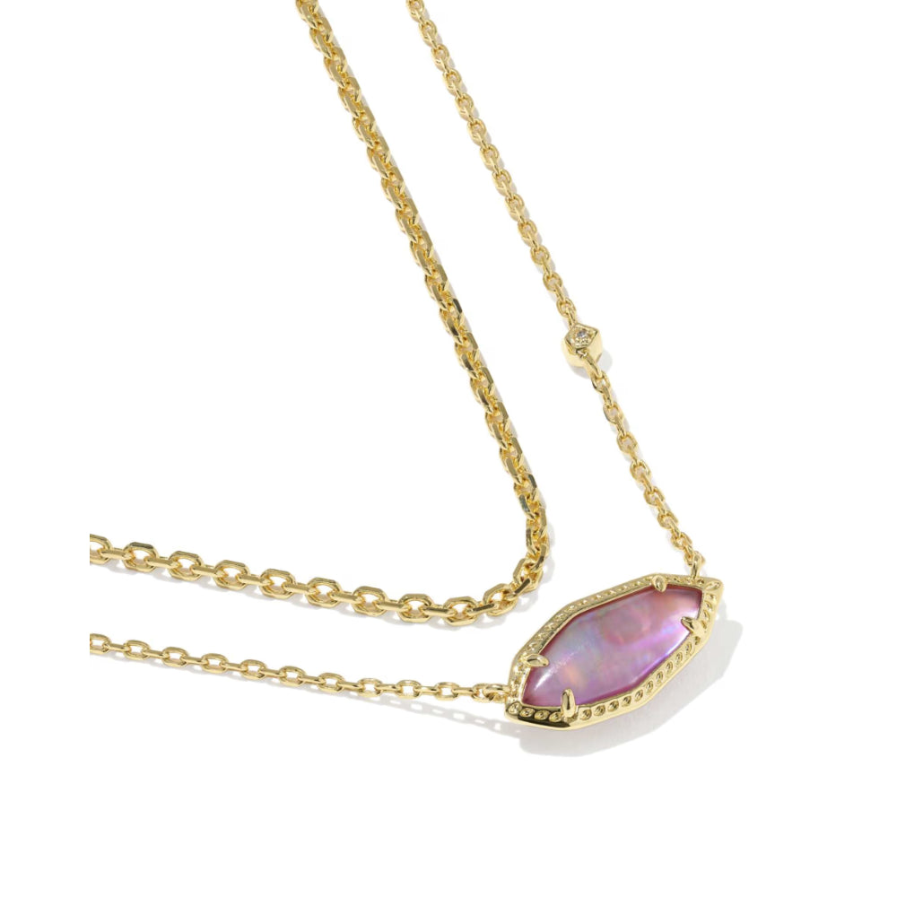 Gold necklace with a pink teardrop pendant on a white background