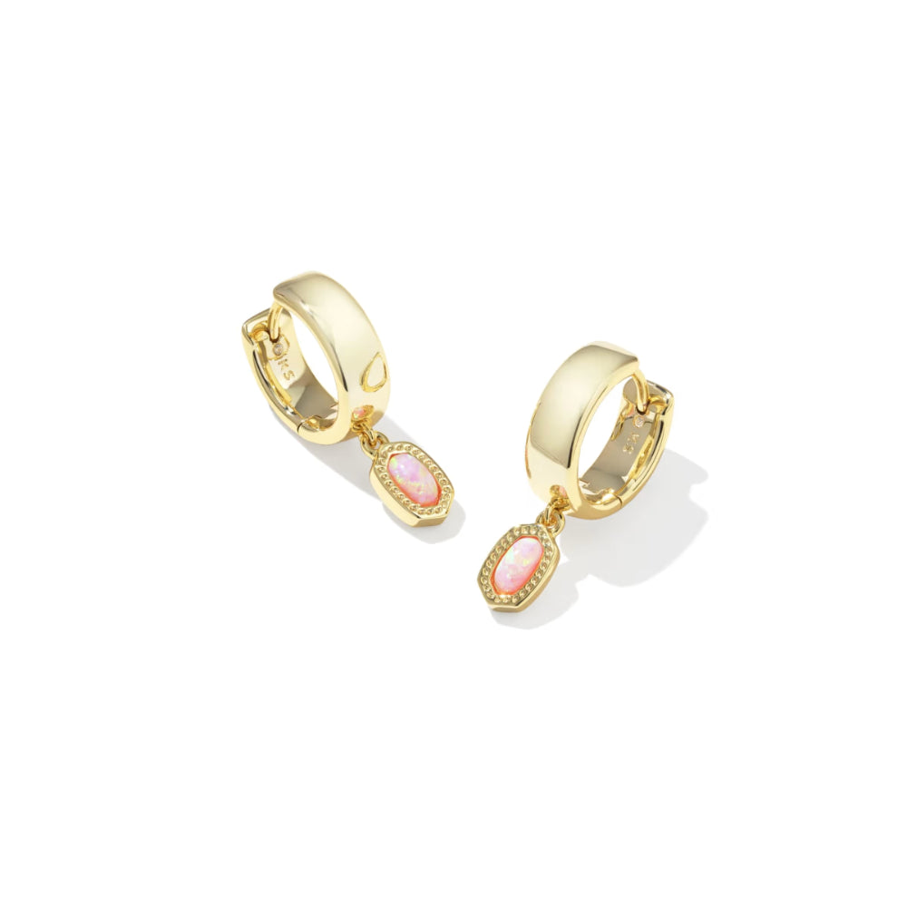 Gold hoop earrings with pink gemstones on a white background