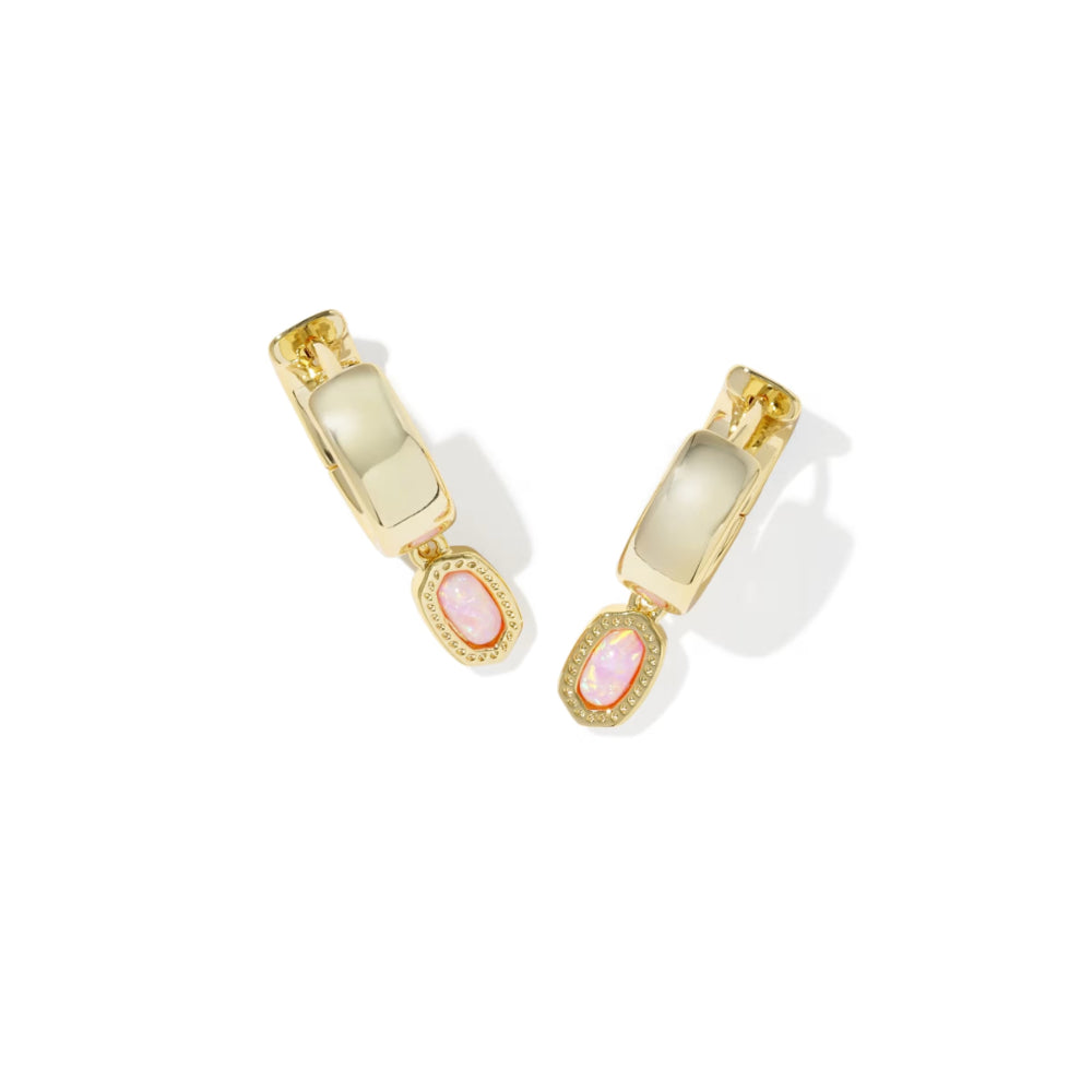 Pair of gold earrings with pink stones on a white background
