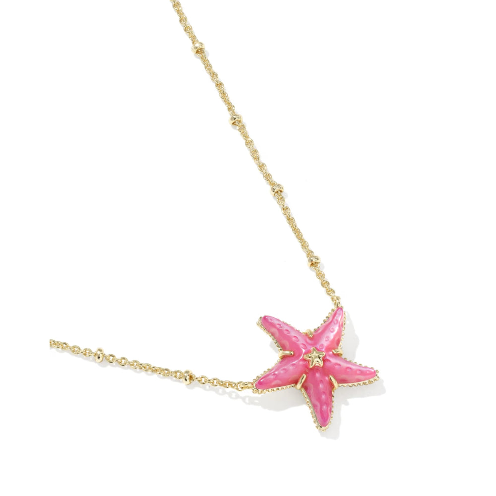 Pink starfish pendant on a gold chain against a white background