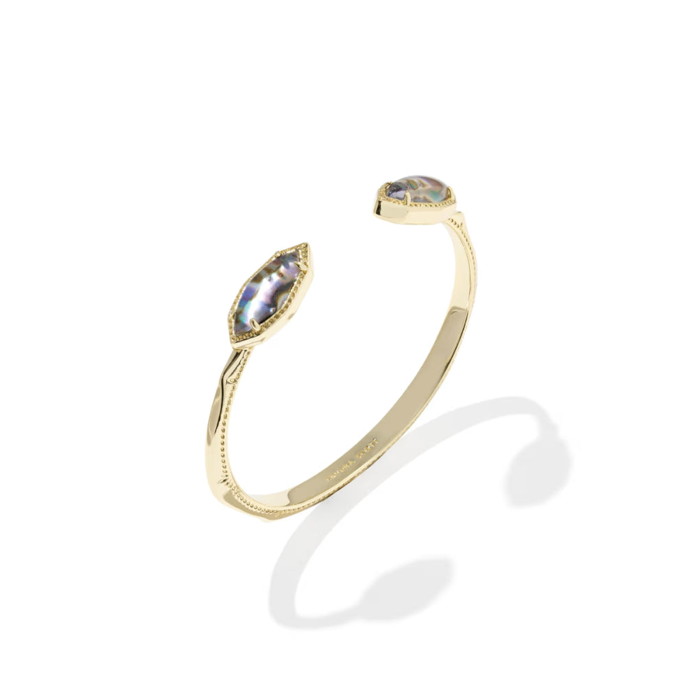 Gold bracelet with gemstones on a white background