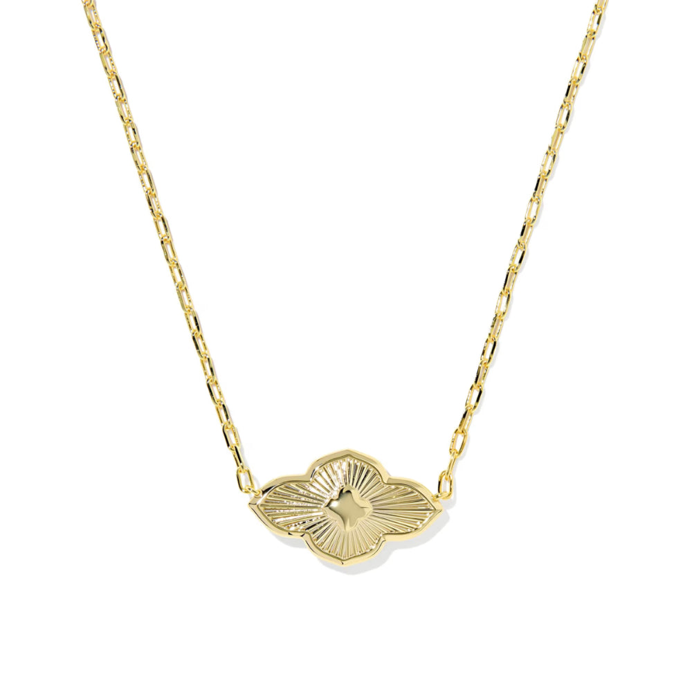 Gold necklace with a leaf-shaped pendant on a white background