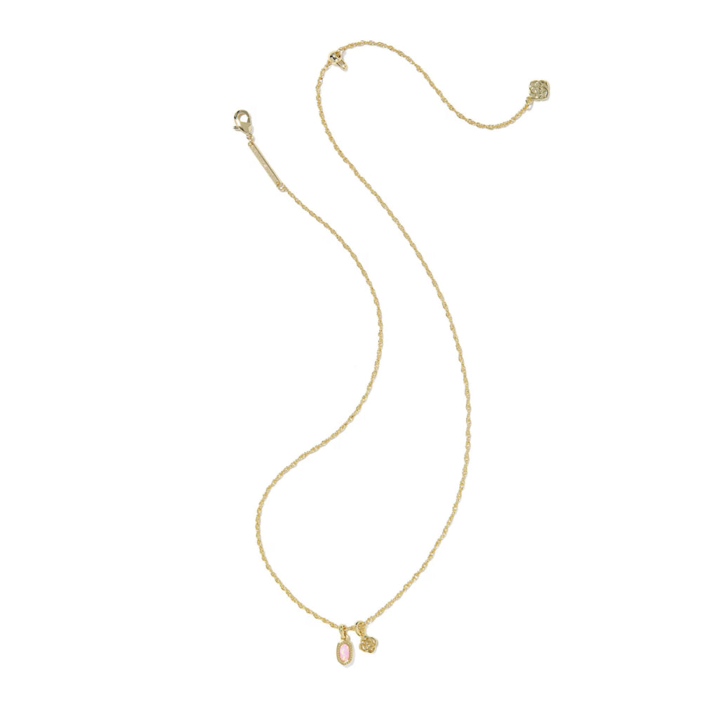 Gold necklace with pink pendant on a white background