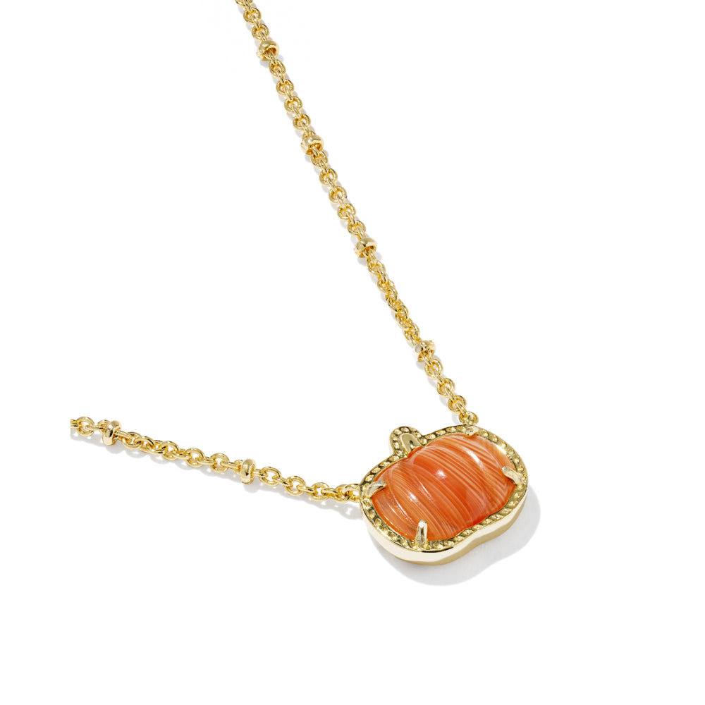 A gold chain necklace featuring a pumpkin-shaped pendant with a carved orange stone in a gold bezel setting, shown on a clean white background.