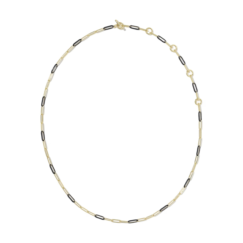 A delicate gold chain necklace with alternating small gold and black oval links, displayed in a circular shape against a plain white background.