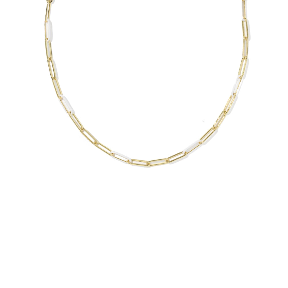 A delicate gold paperclip chain necklace with alternating small white inlay links, shown on a plain white background.