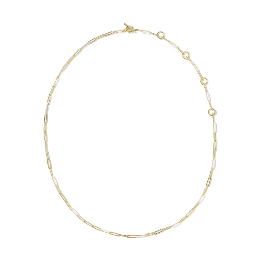 A delicate gold chain necklace with alternating small gold and white oval links, arranged in a circle on a plain white background.