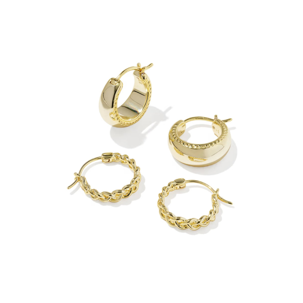 Set of gold hoop earrings on a white background