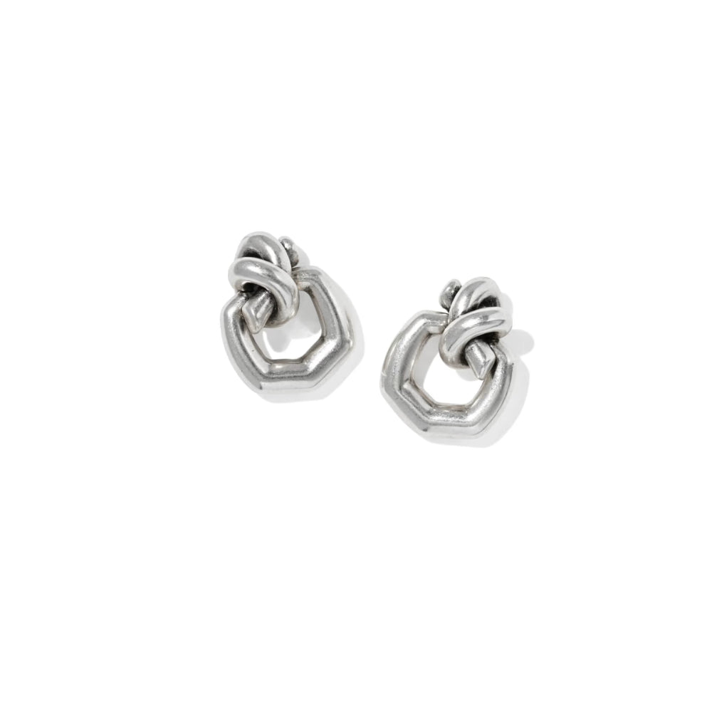 Pair of silver hoop earrings on a white background