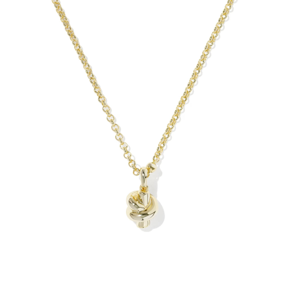 Gold necklace with a unique pendant on a white background