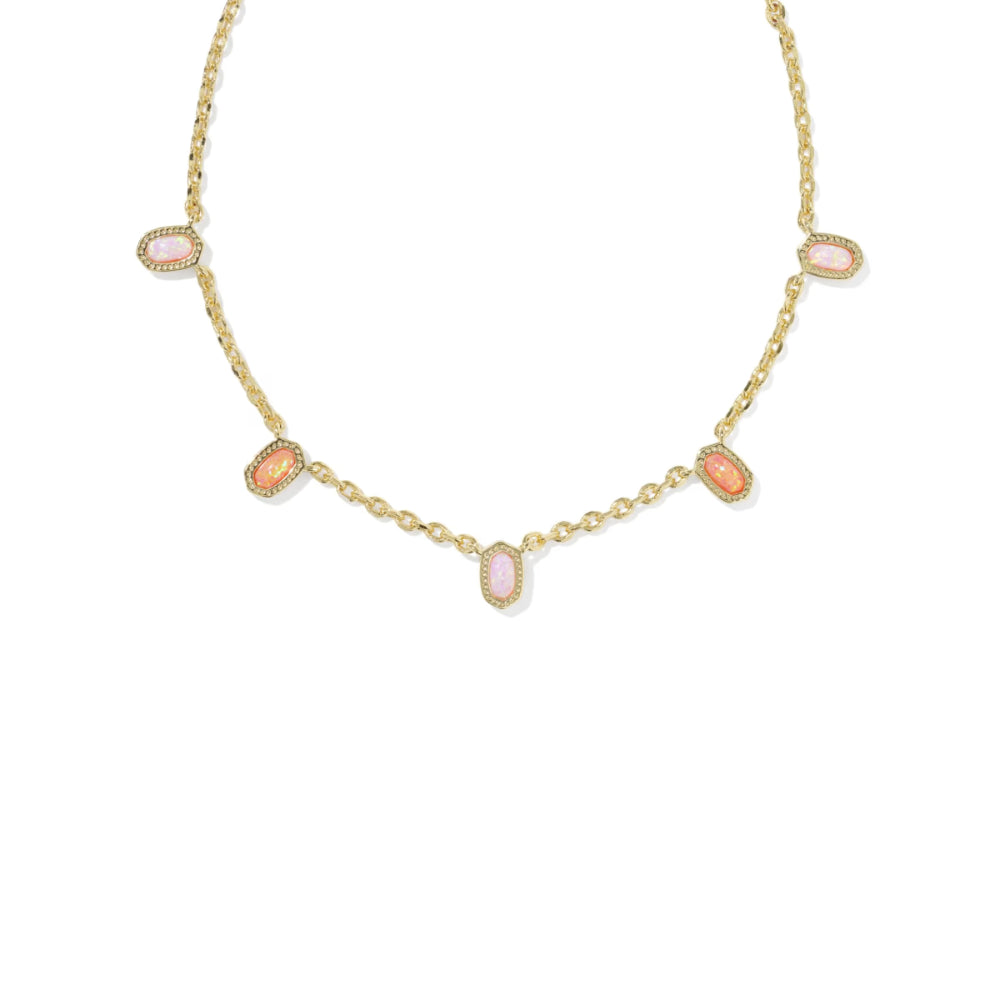 Gold necklace with pink gemstones on a white background