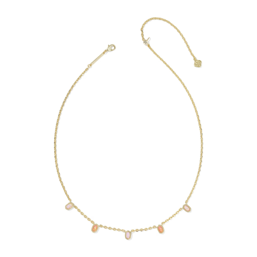 Gold necklace with small gemstones on a white background