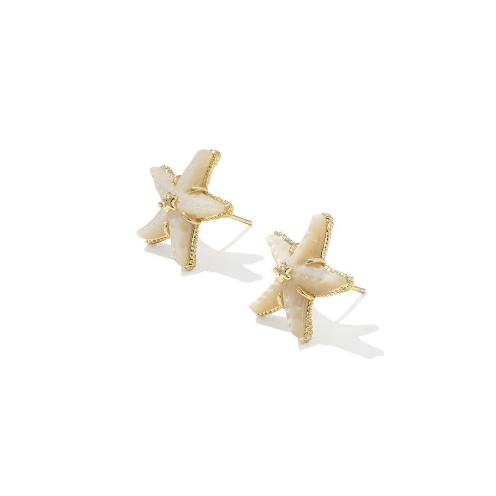 Star-shaped earrings with gold and white details on a white background