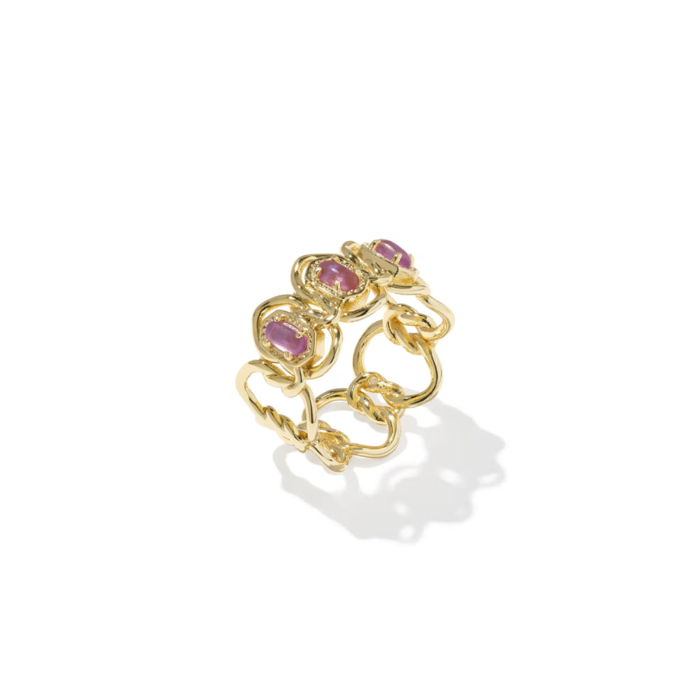 Gold chain ring with pink gemstones on a white background