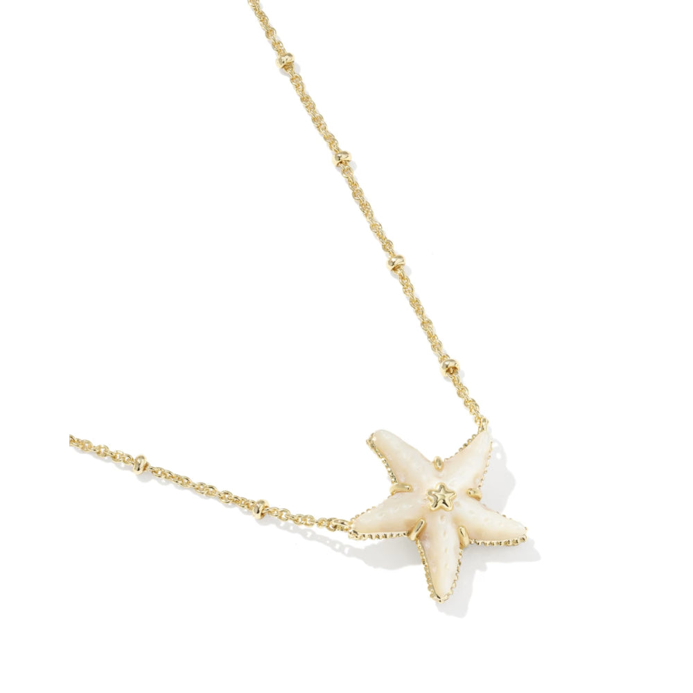 Starfish pendant necklace on a gold chain with a white background