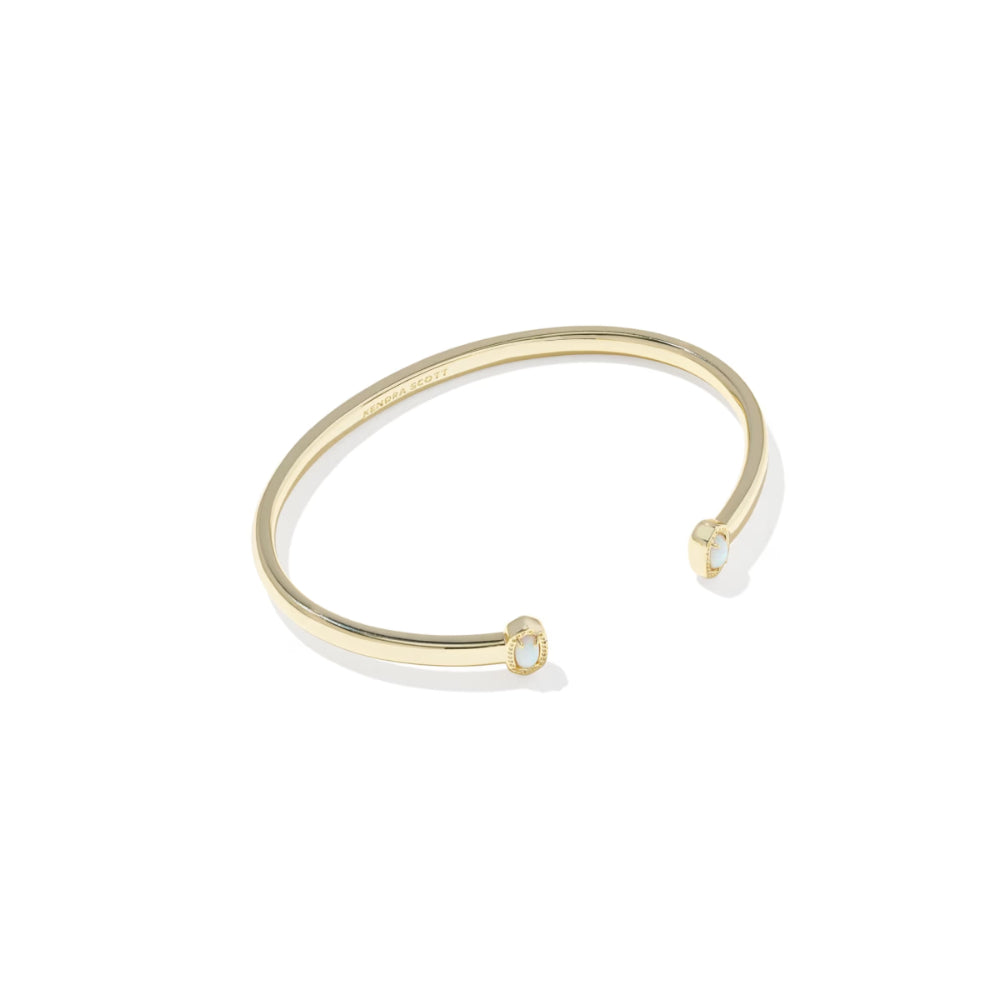 Gold bangle on a white background