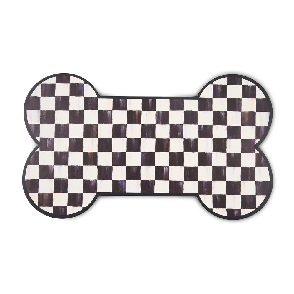 Bone-shaped black and white checkered mat on a white background