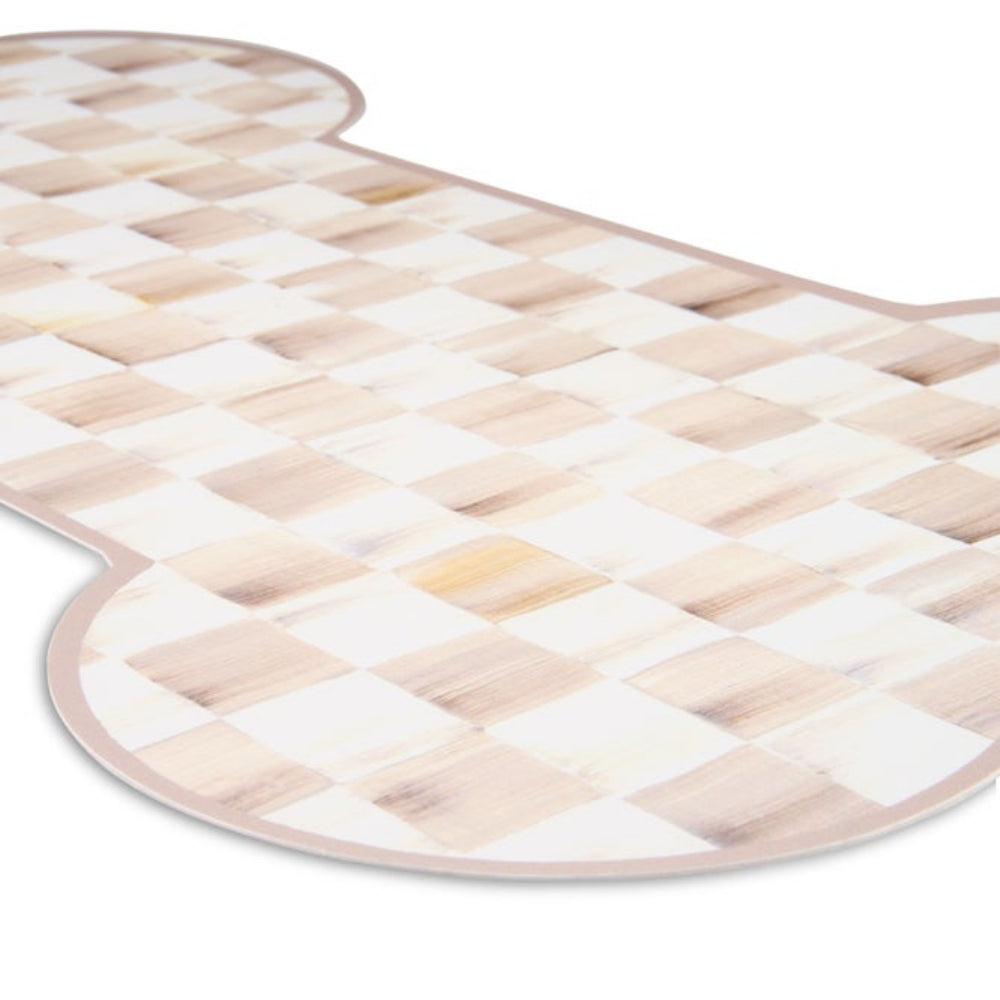 A bone-shaped mat with a light beige and white checkerboard pattern, shown on a plain white background.