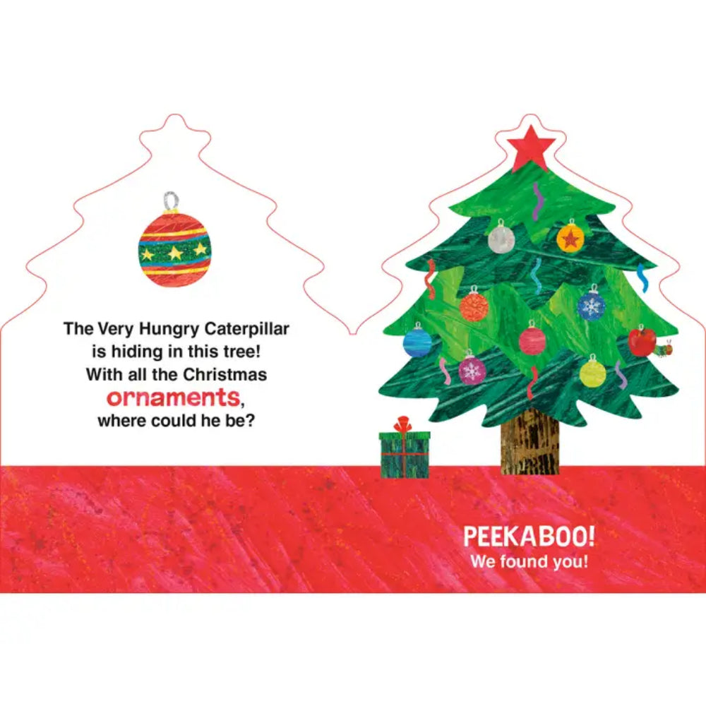 A Christmas-themed peek-a-boo card or print featuring a green Christmas tree with colorful ornaments, a red star topper, a small gift box, and text that reads, 'The Very Hungry Caterpillar is hiding in this tree! With all the Christmas ornaments, where could he be?' with 'PEEKABOO! We found you!' at the bottom.