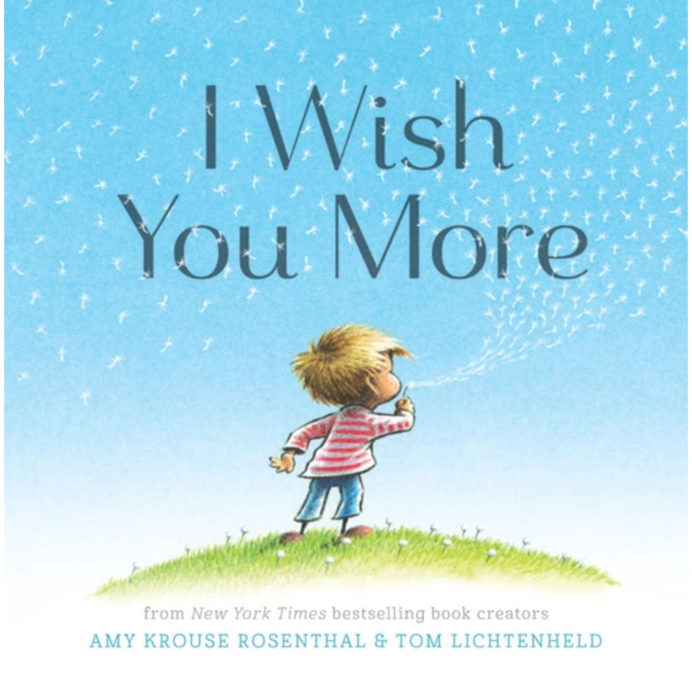 Book cover of 'I Wish You More' with a child blowing dandelions against a blue sky.