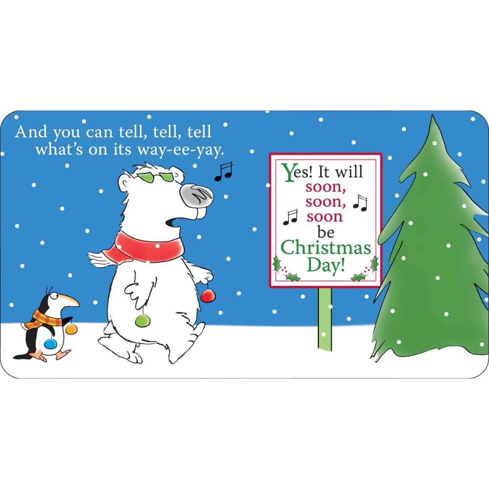 A rectangular Christmas-themed sign or plaque with rounded corners, featuring a cartoon polar bear wearing sunglasses and a red scarf, a penguin, a snow tree, and text that reads, 'And you can tell, tell, tell what's on its way--ee-yay!' and 'Yes! It will soon, soon, soon be Christmas Day!'.