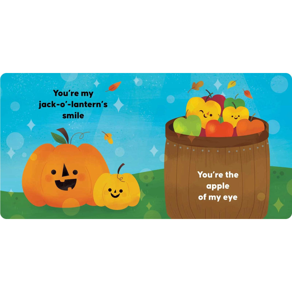 A square Halloween-themed greeting card or print with playful text and cartoon illustrations. The design shows an orange jack-o'-lantern, a smaller yellow pumpkin, a brown barrel filled with smiling apples, and a bright blue background with green grass and small floating stars.