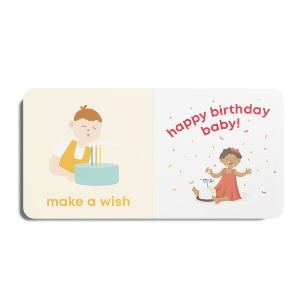 Children's book with illustrations of a boy and girl, birthday cake, and text 'happy birthday baby! make a wish'.