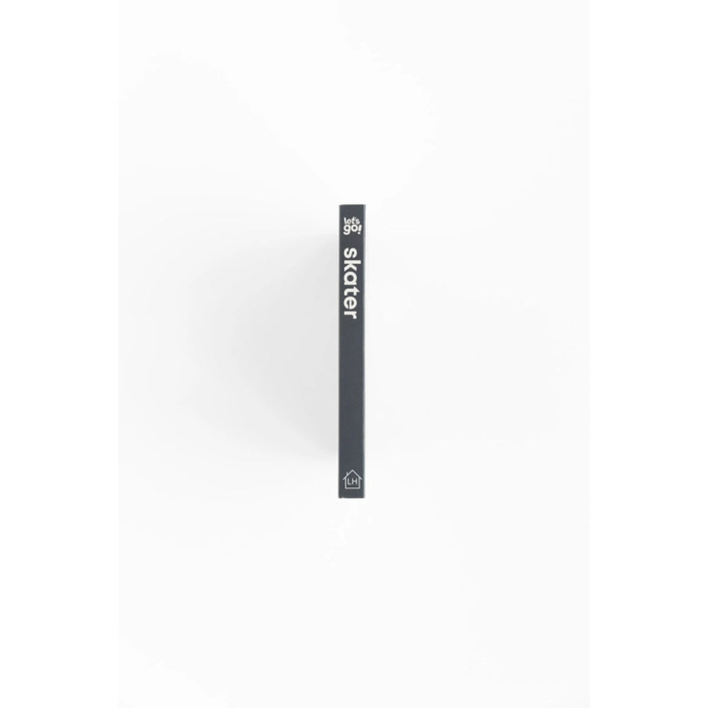 Black skateboard deck with 'skater' branding on a white background