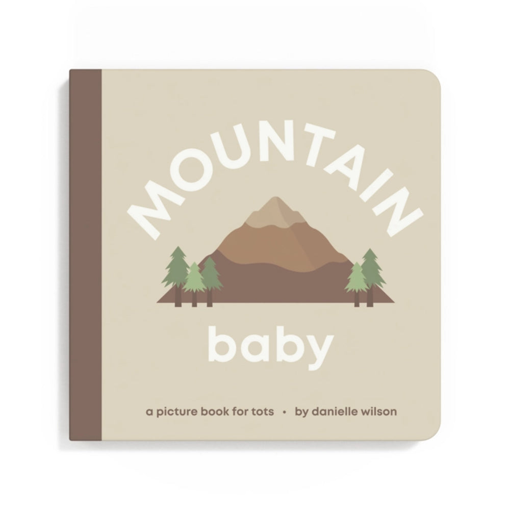 Book titled 'Mountain Baby' with a mountain and trees illustration on a beige background