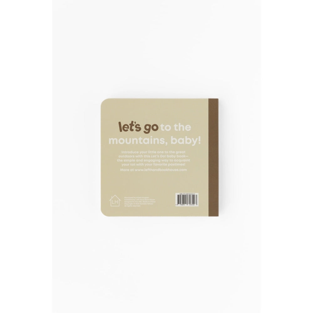 book with text 'let's go to the mountains, baby!' on a beige background