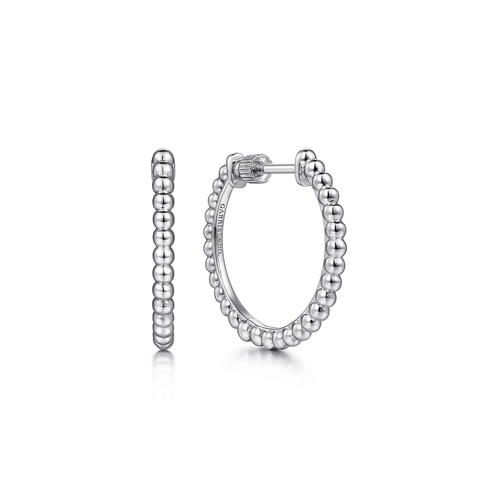 Silver hoop earrings on a white background