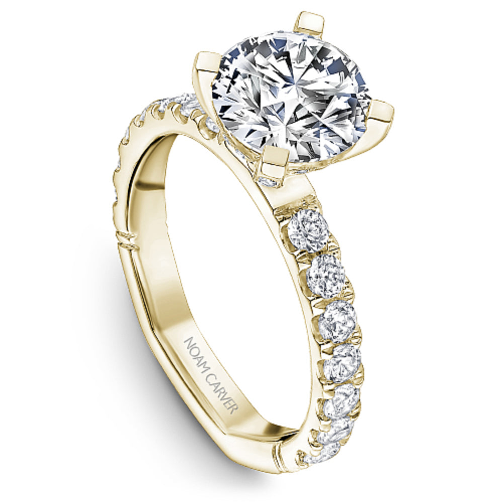 Yellow gold diamond ring with 'Noam Carver' branding on a white background