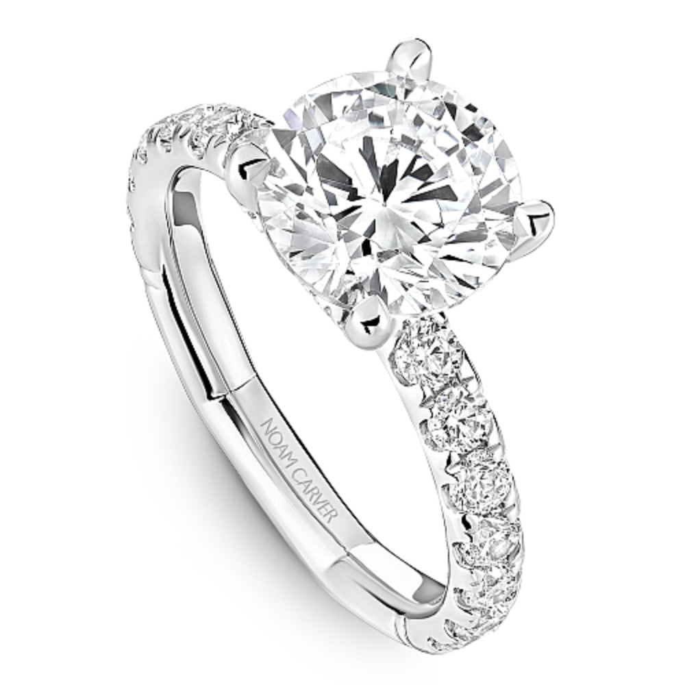 Diamond ring with 'Noam Carver' branding on a white background