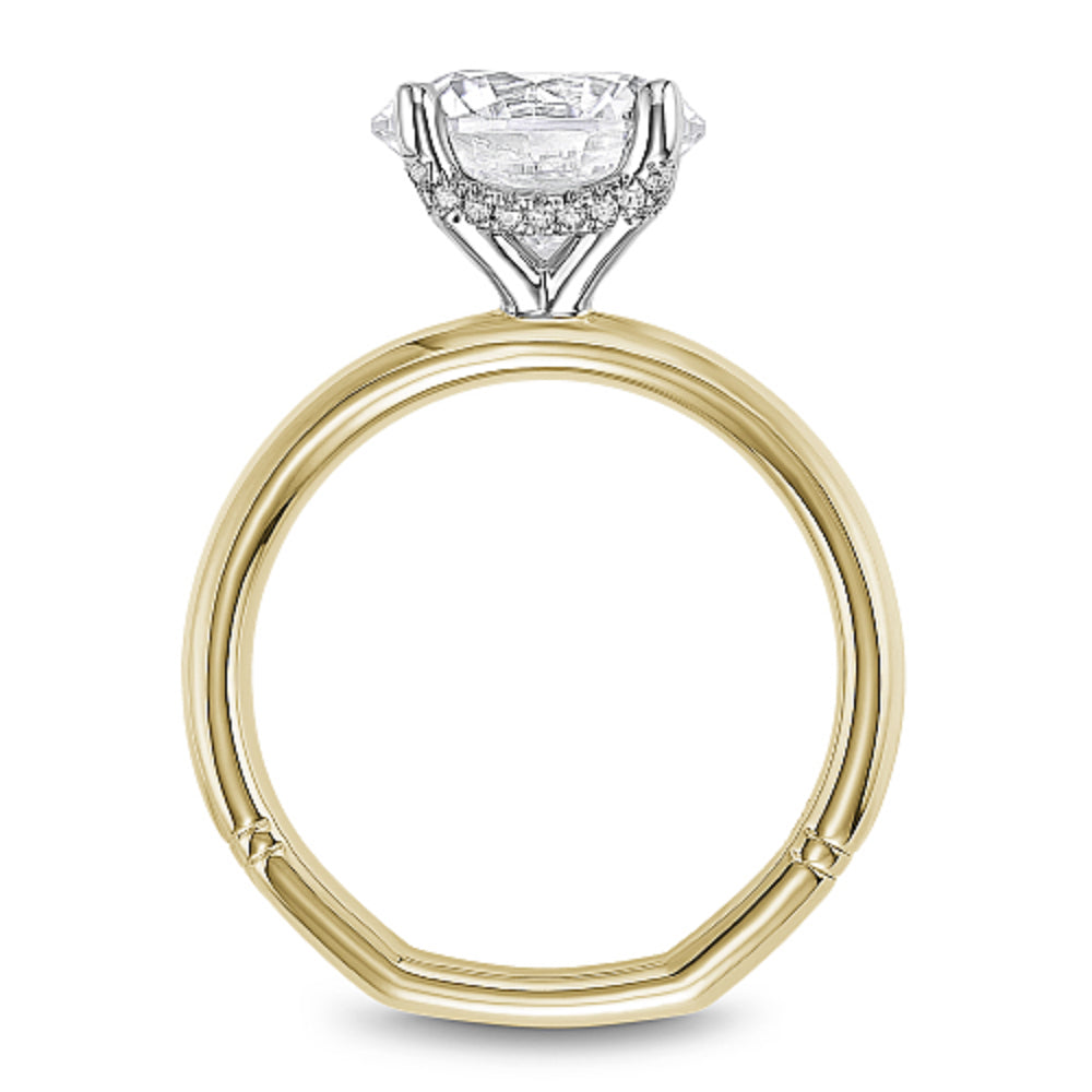 Gold Noam Carver ring with a round diamond center on a white background