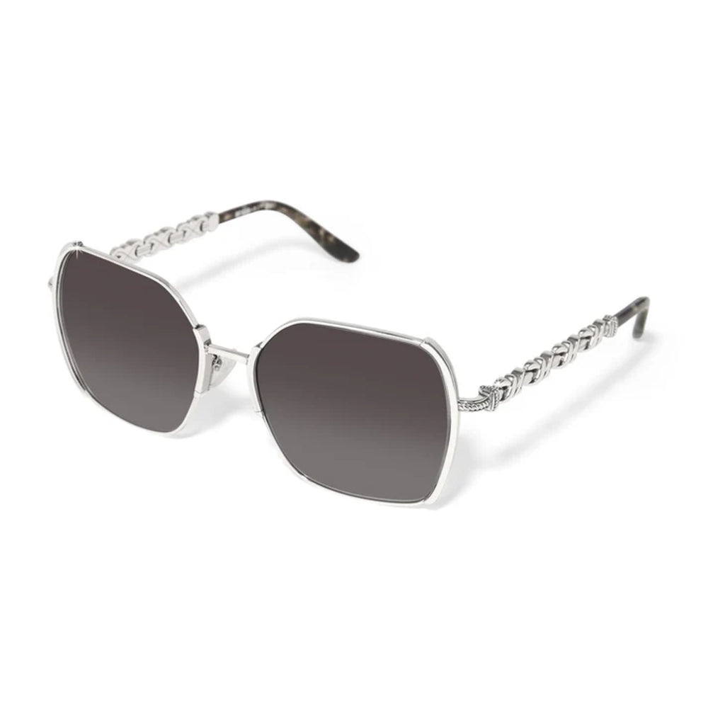 Sunglasses with a silver frame and dark lenses on a white background